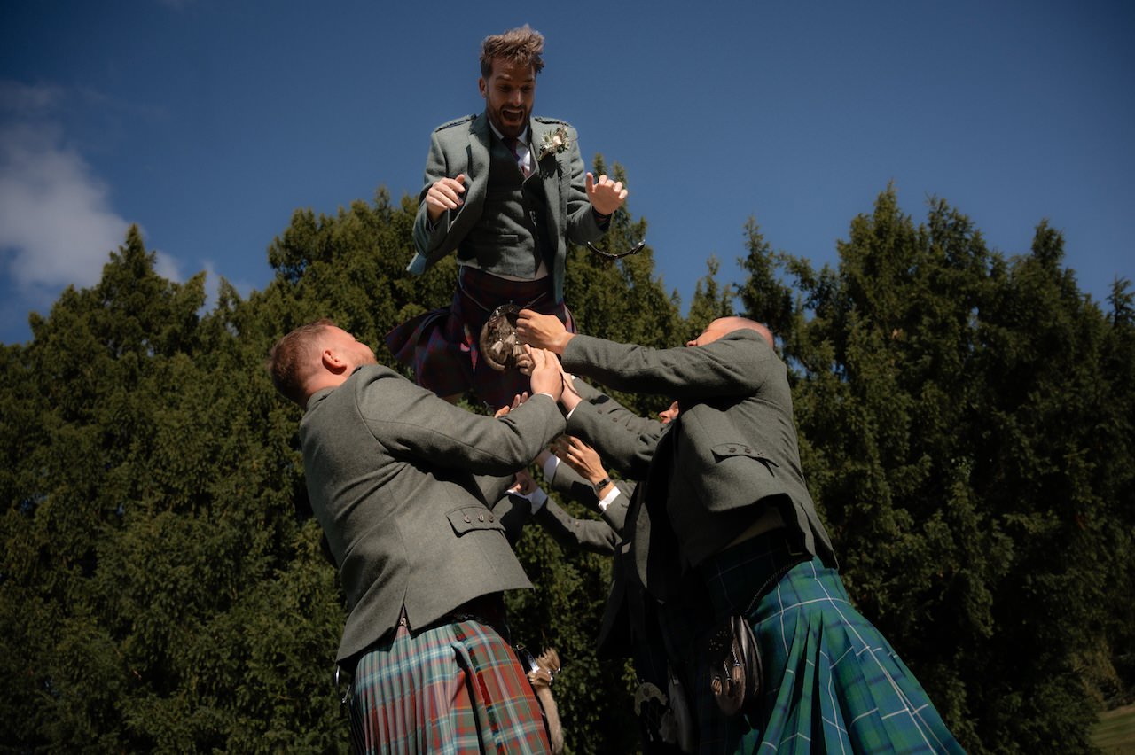 The Big Fat Scottish Wedding in Highlands 27 Groom Fun Relaxed Wedding Photographer