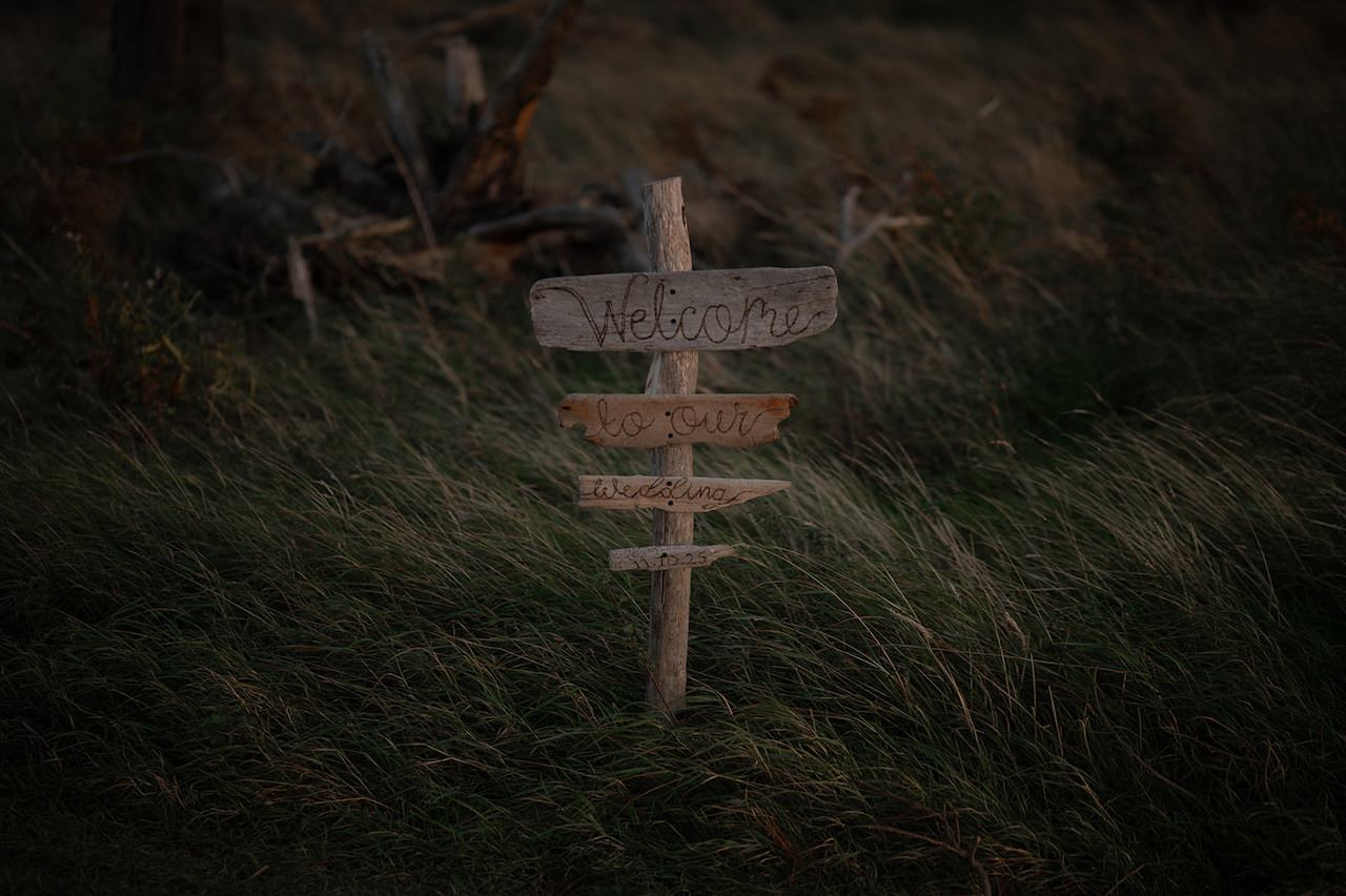 Wooden sign welcomes to wedding