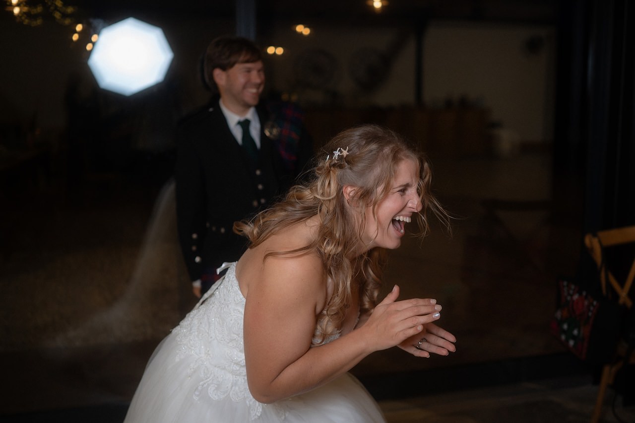 Reportage candid photography bride  and groom cheering 