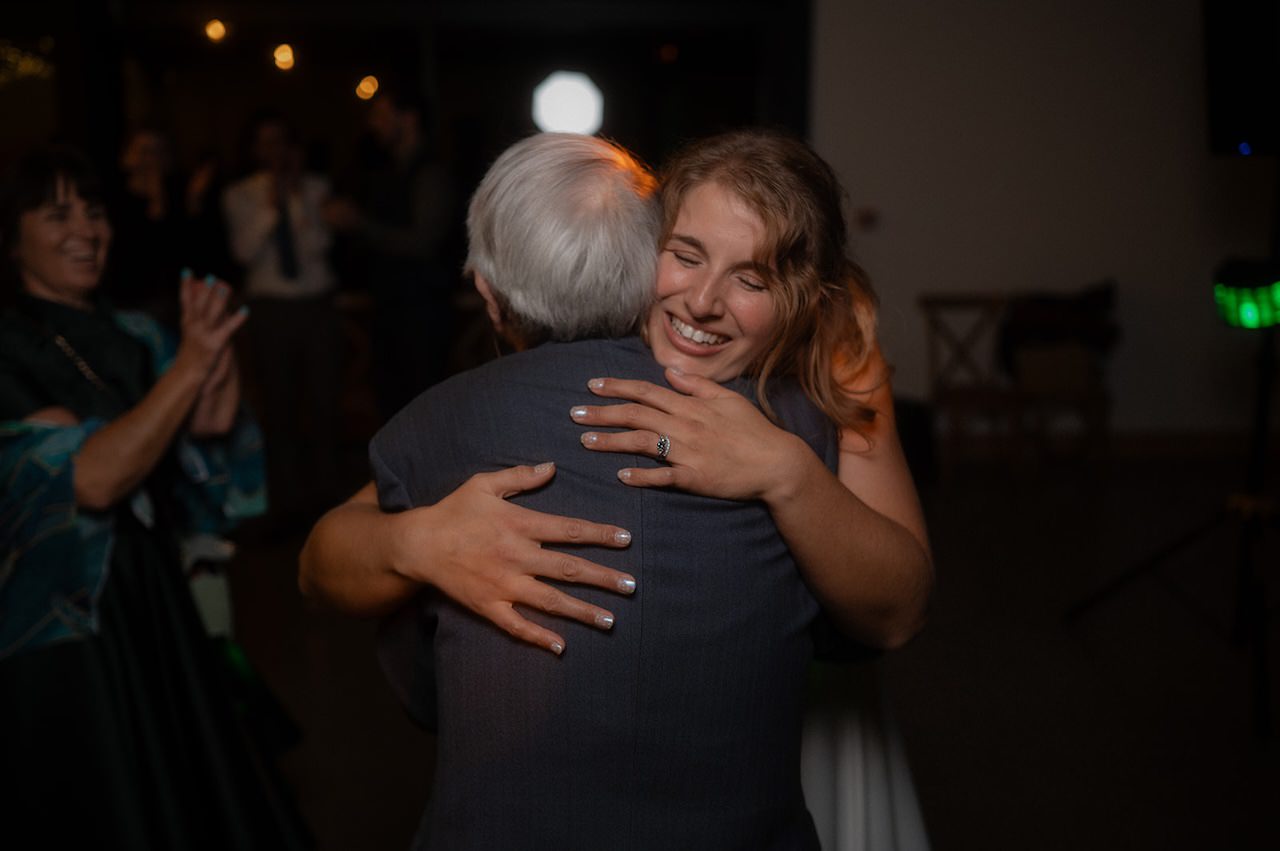 Bride dance floor hug grandad