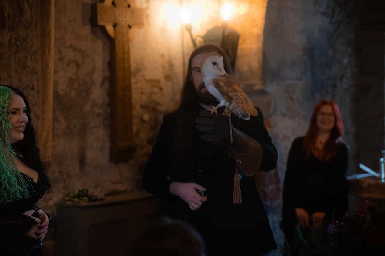 Gothic Wedding Ceremony an Owl deliver wedding rings