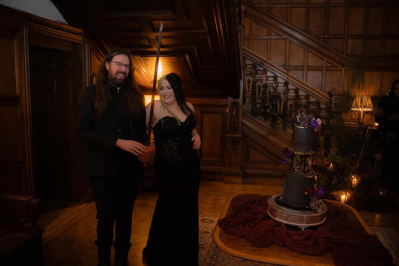 Goth wedding cake cutting