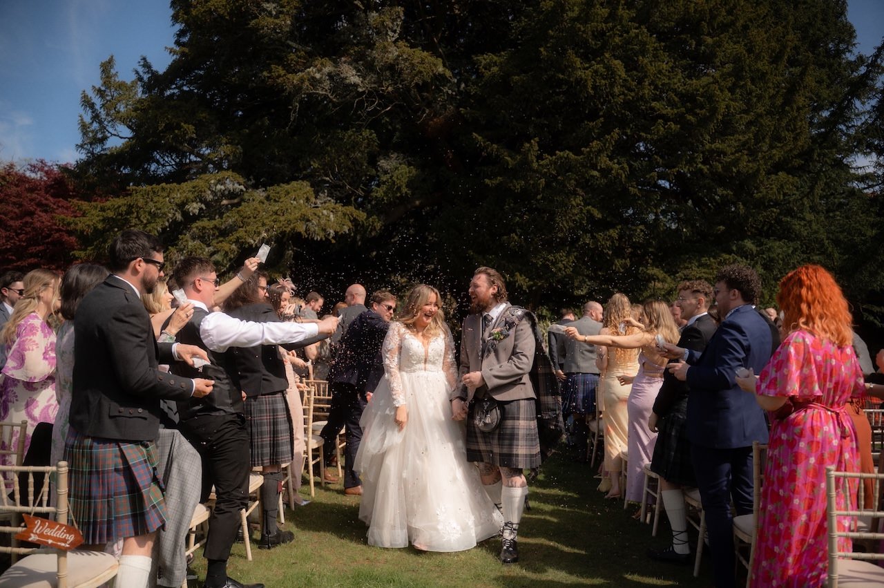 Kelburn Castle Wedding Photography - Chloe And Stewart's Big Day 40 Kelburn Castle Wedding ceremony confetti in the walled garden